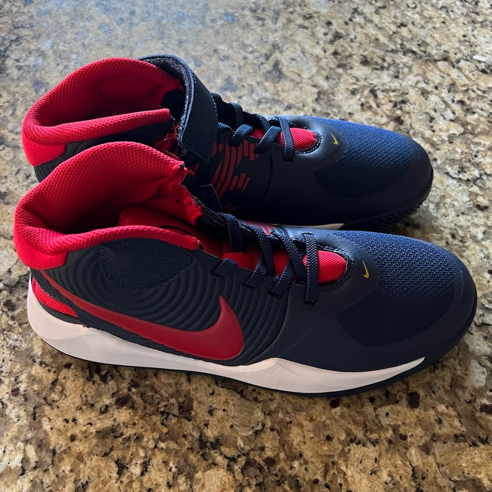 Nike Kids Team Hustle D9 Shoes Size
US 6 youth Midnight Navy / University Red.